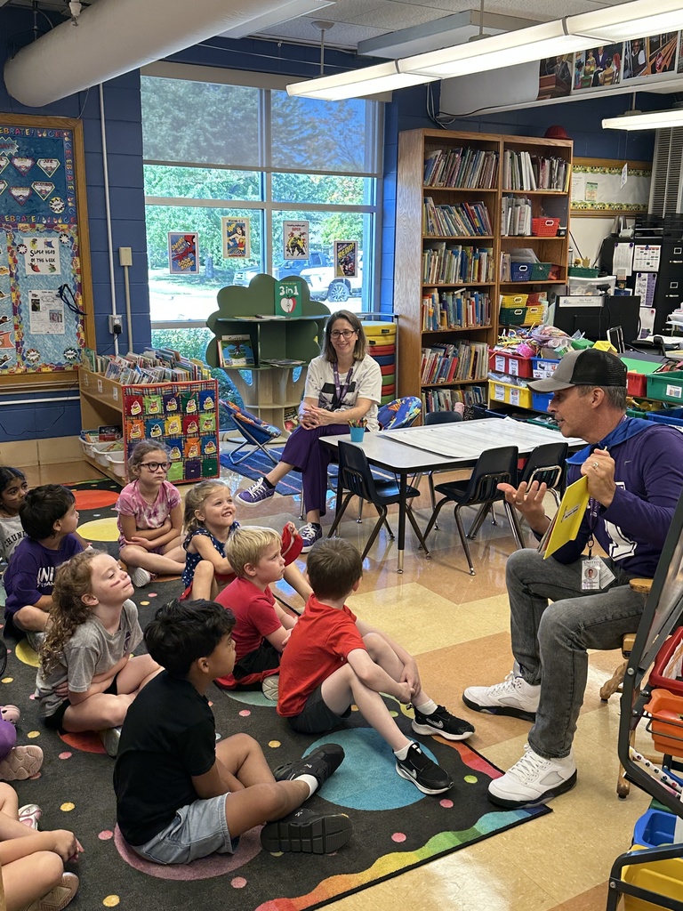 head of school reading to the kindergarten students