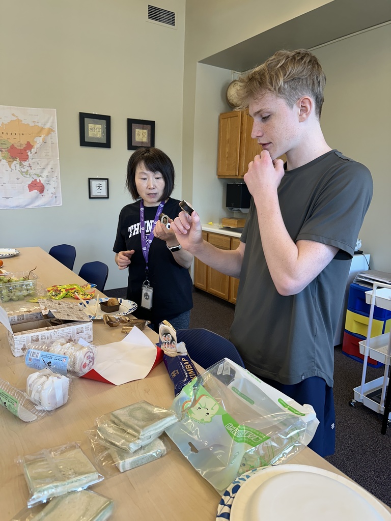 teacher and student trying sushi