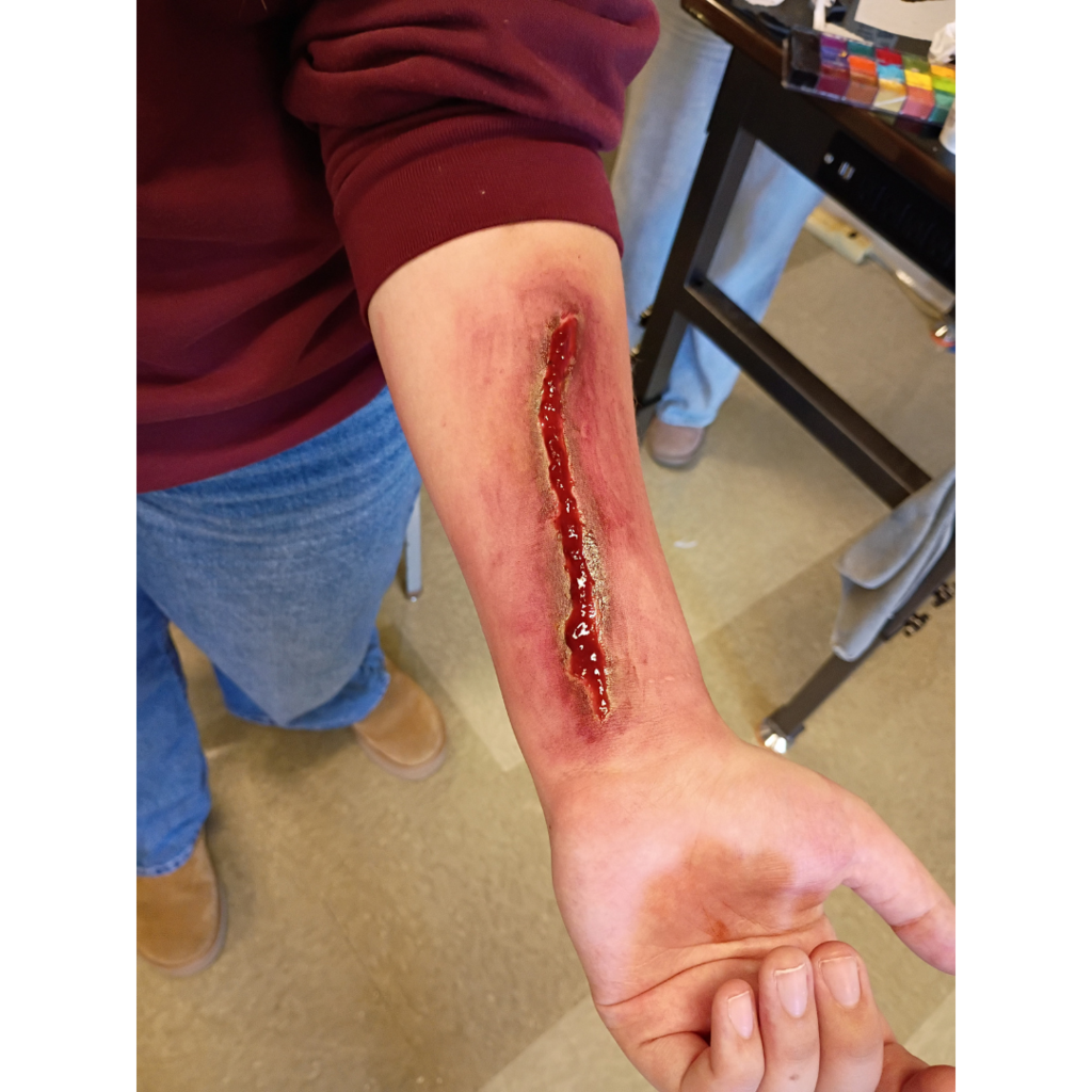 fake laceration on a student's arm
