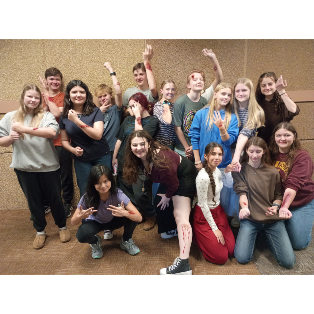 group photo of anatomy students showing their fake injuries
