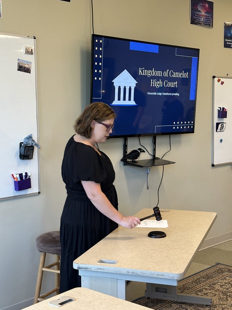 teacher acting as a judge with a gavel