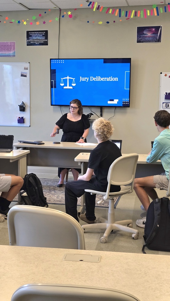 teacher acting as a judge with a gavel