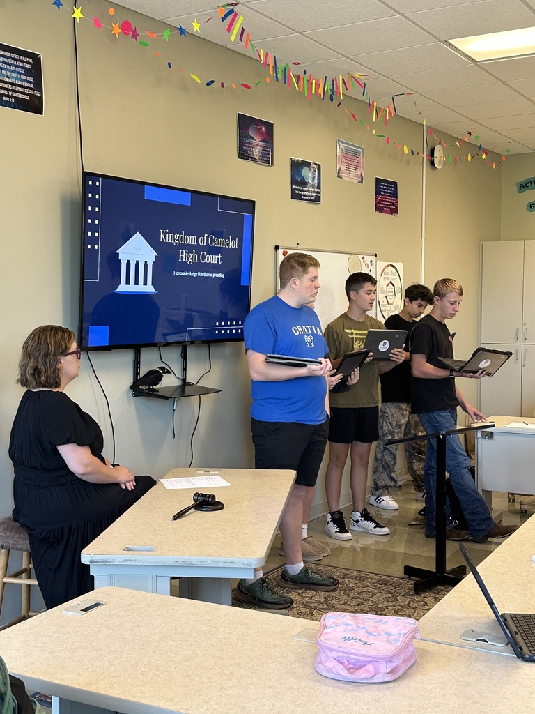 students acting as a defense team in a mock trial