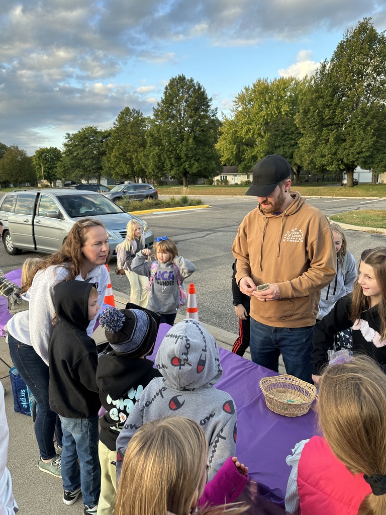 students taking money from parents as they sell donuts