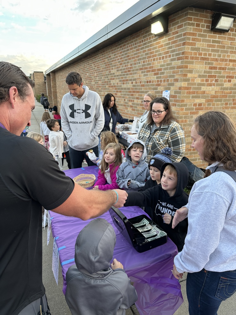 students selling donuts to other students and parents