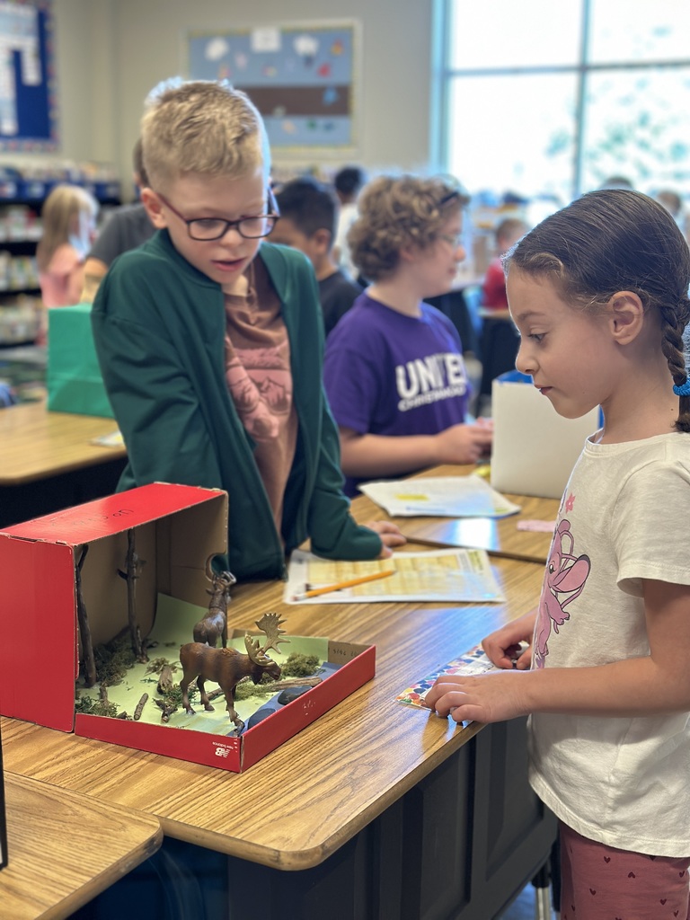 2nd grade students sharing facts about the habitat projects they created
