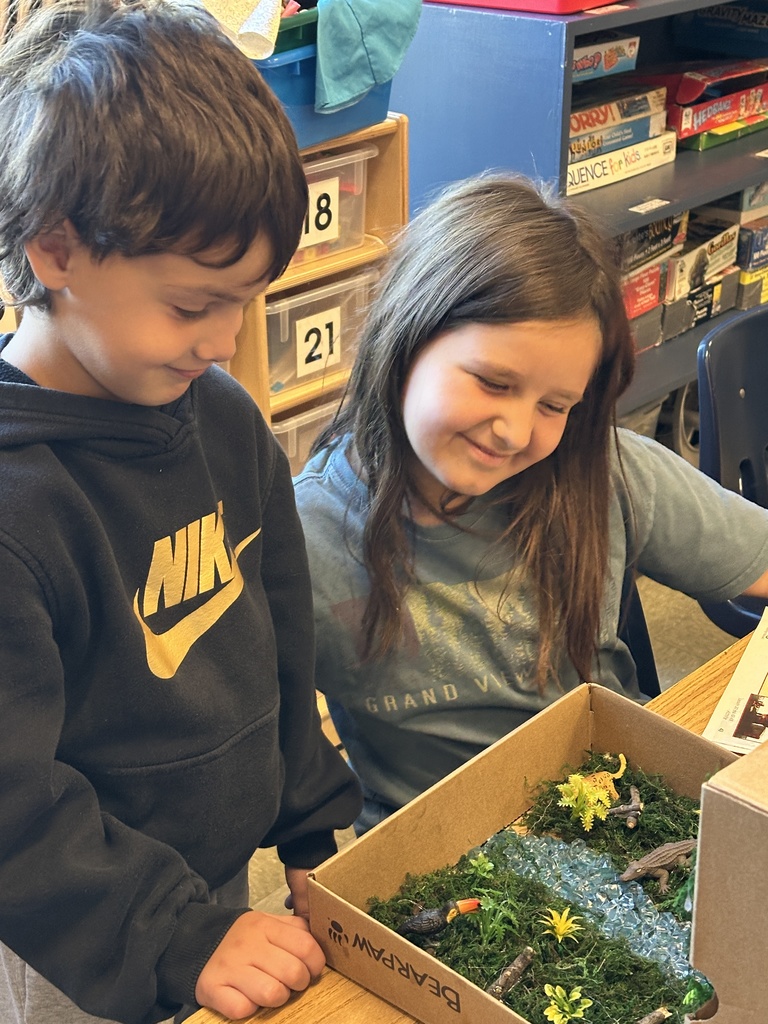 2nd grade students sharing facts about the habitat projects they created