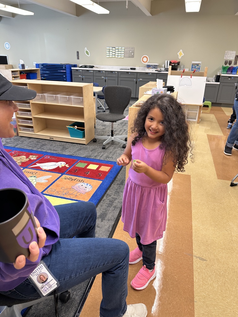 PreK student showing the gem she just drew out of a jar
