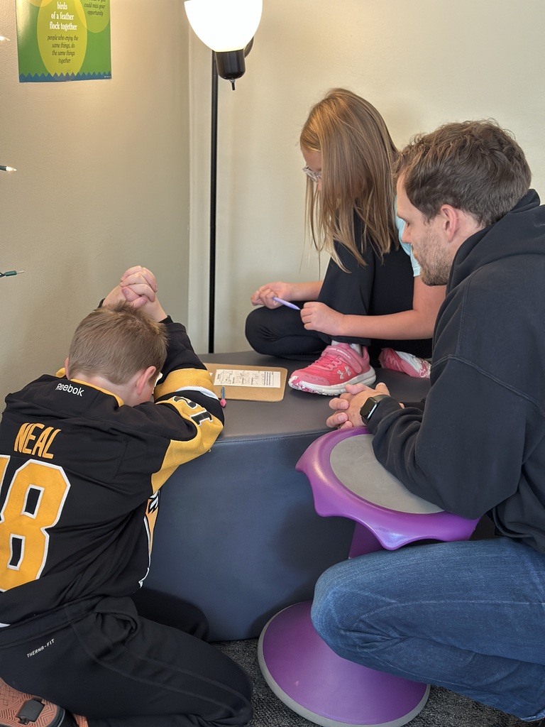 two students and a teacher praying