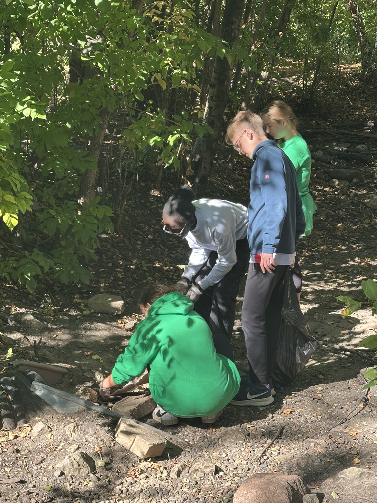 students picking up trash for a service project