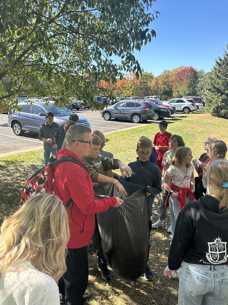 students picking up trash for a service project