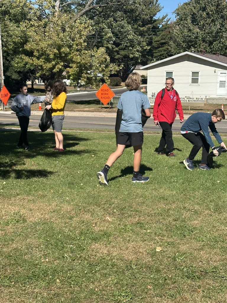 students picking up trash for a service project