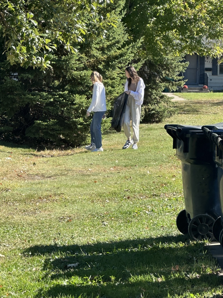 students picking up trash for a service project