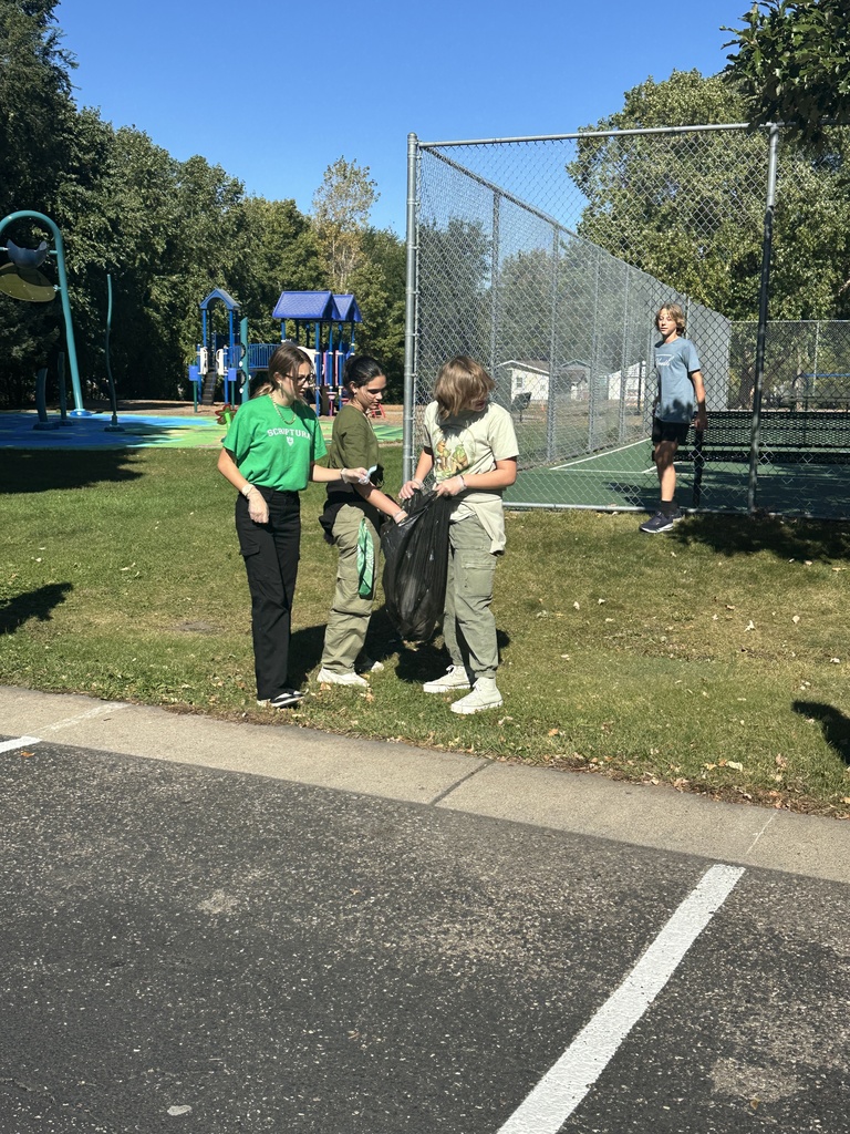 students picking up trash for a service project