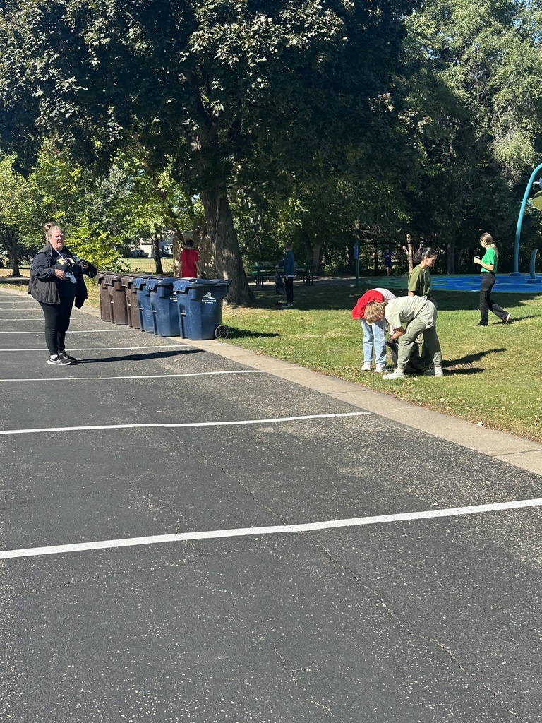 students picking up trash for a service project