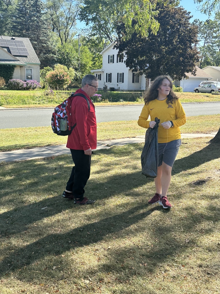 students picking up trash for a service project