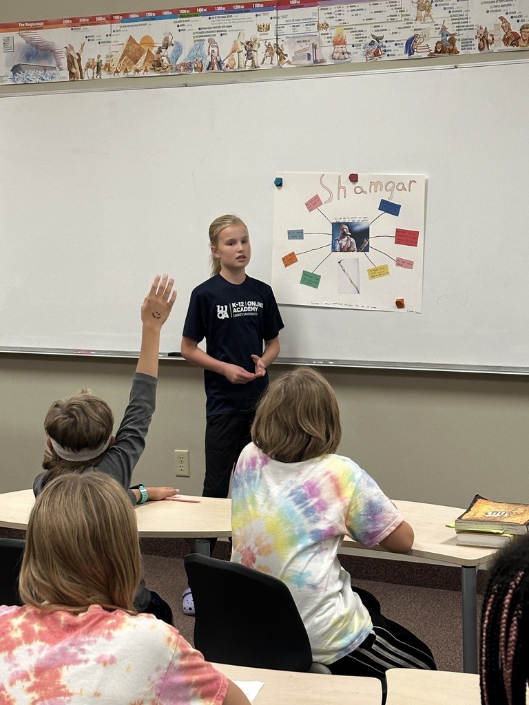 student presenting in front of her classmates