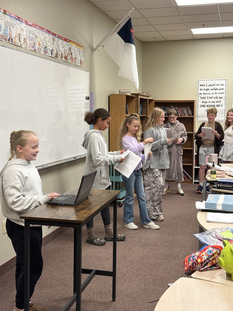 students performing a skit in front of classmates