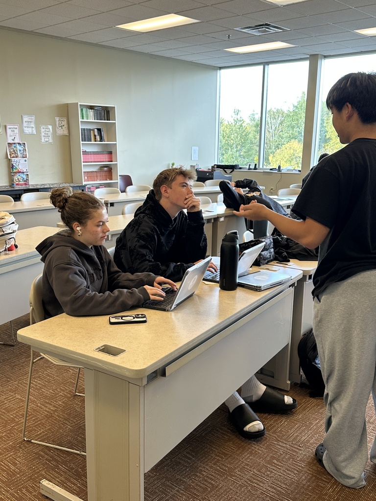 students talking to each other about a project