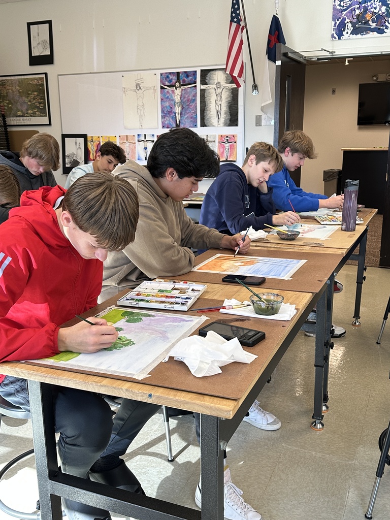 high school students doing a watercolor art project to paint fall leaves