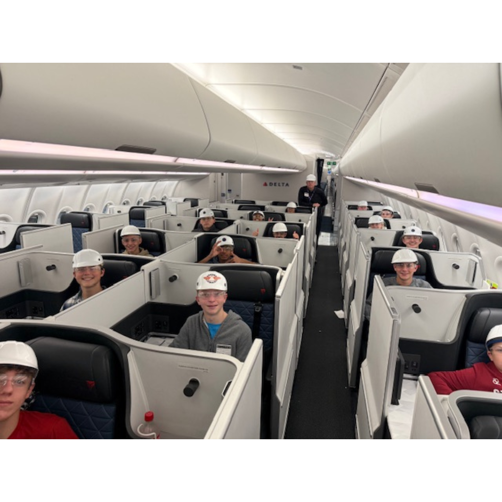 students sitting in first class seats of an Airbus 330