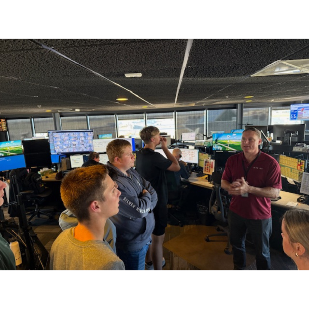 aviation students on tour in a Delta control tower