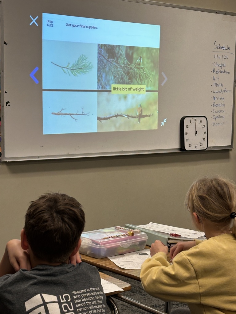 4th grade students working in pairs at their desks doing a science experiment