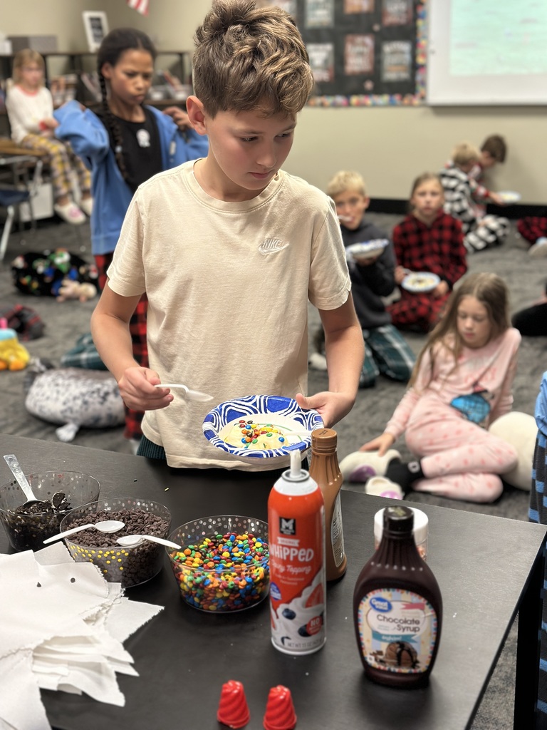students scooping up ice cream toppings