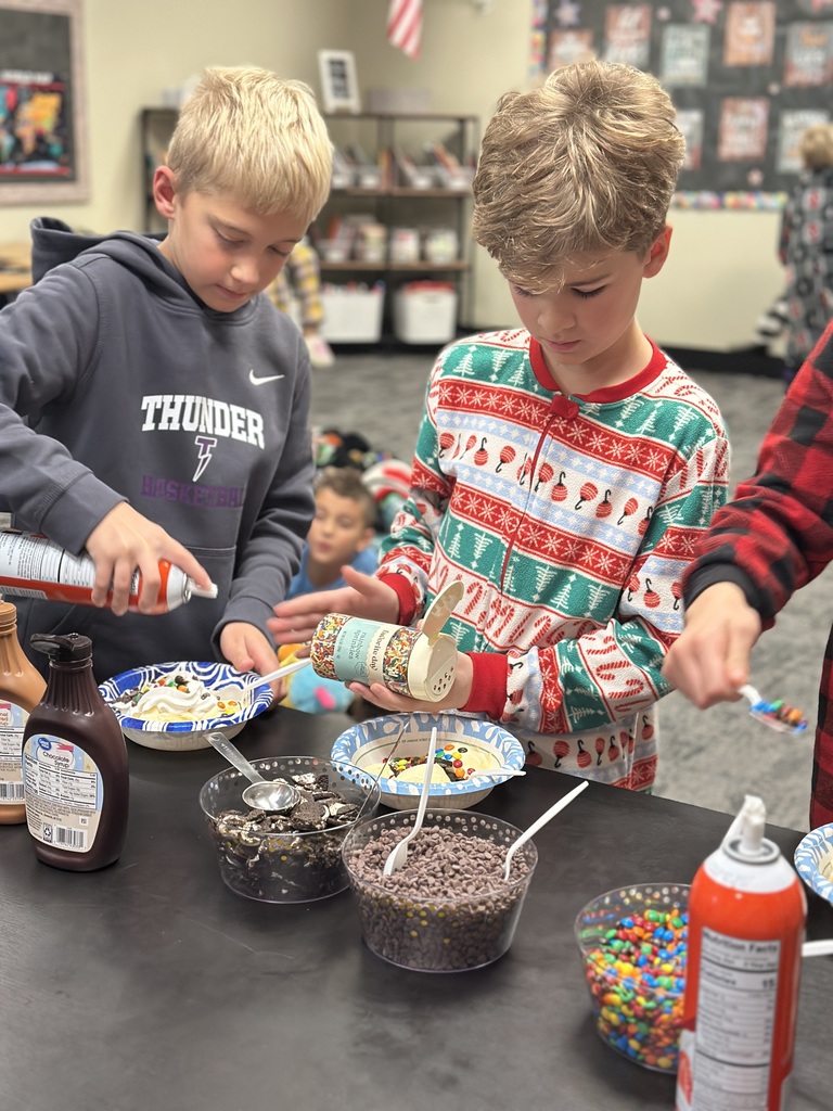 students scooping up ice cream toppings