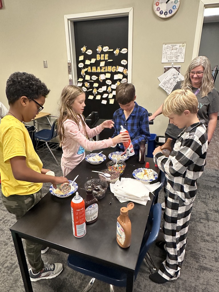 students scooping up ice cream toppings