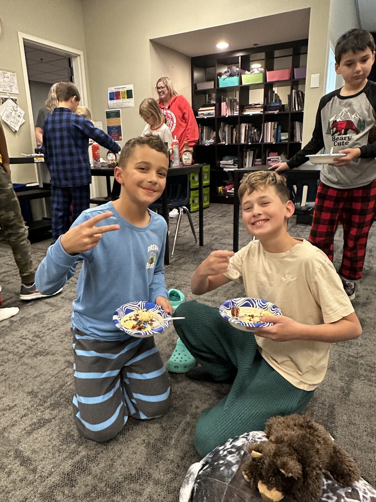 group of students wearing pajamas and eating ice cream