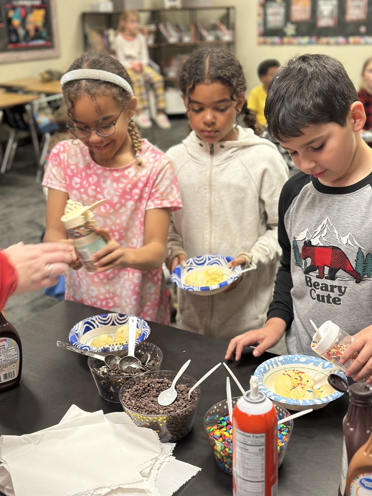 students scooping up ice cream toppings