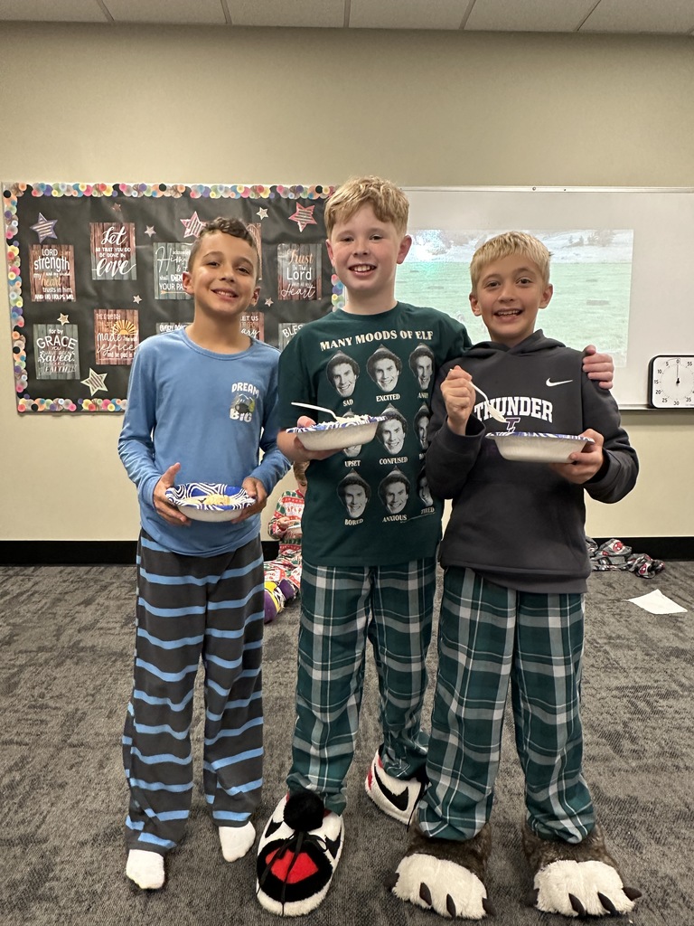 group of students wearing pajamas and eating ice cream
