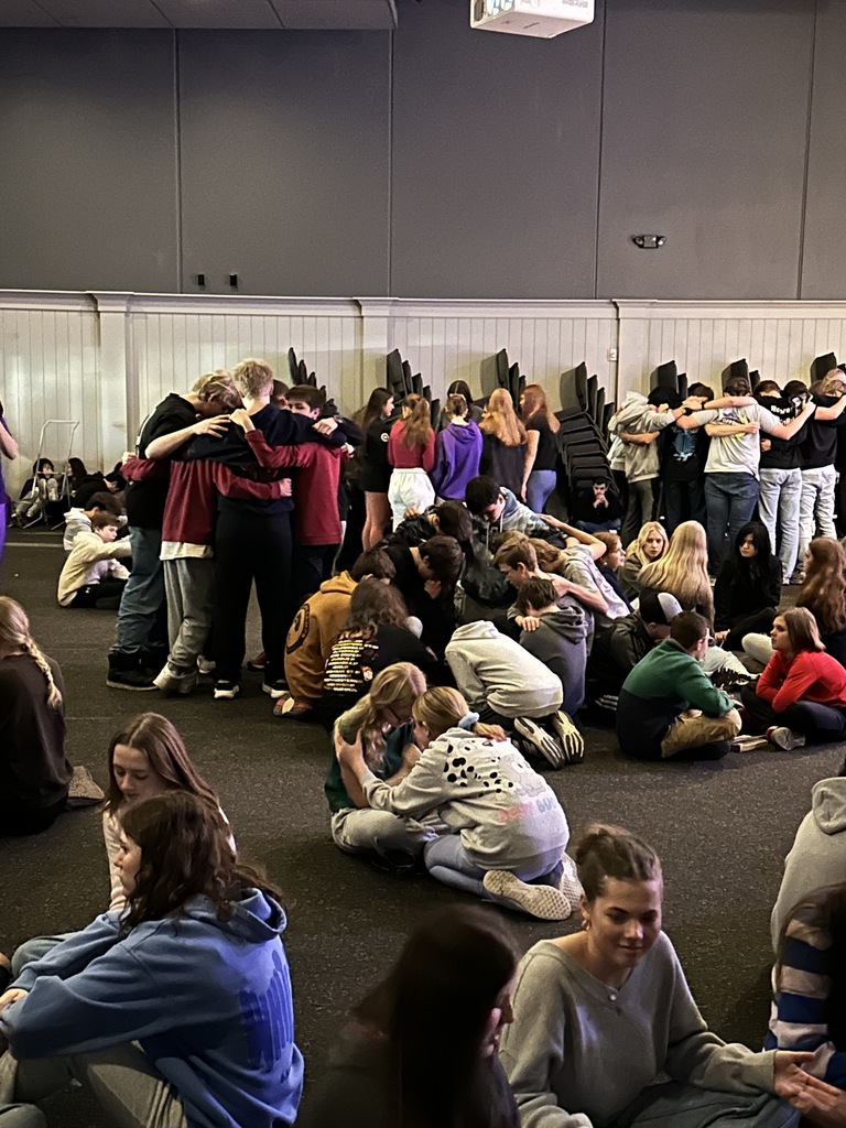 groups of students praying together