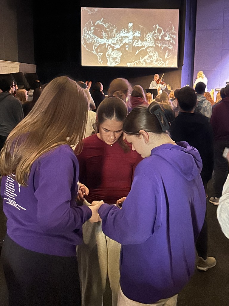 groups of students praying together
