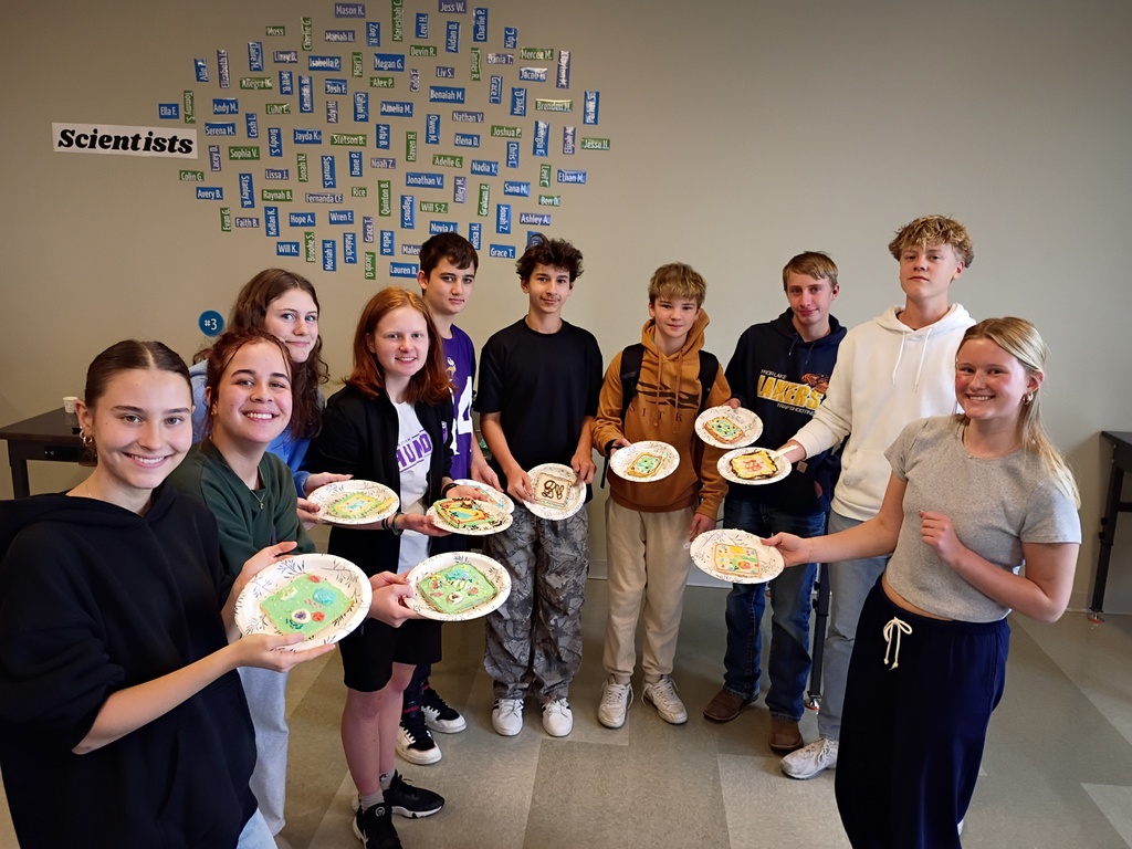 group of students showing their decorated cookies