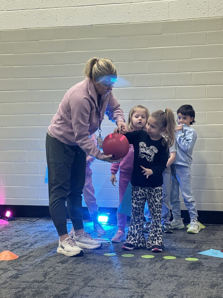elementary students learning bowling in PE class