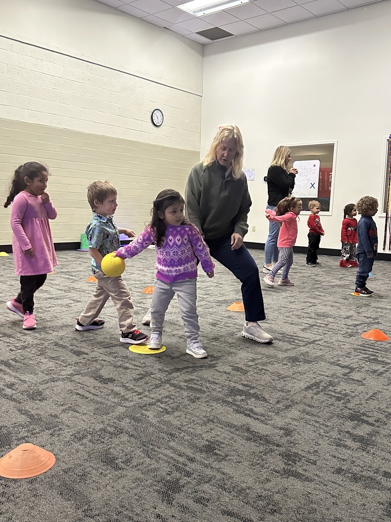 elementary students learning bowling in PE class