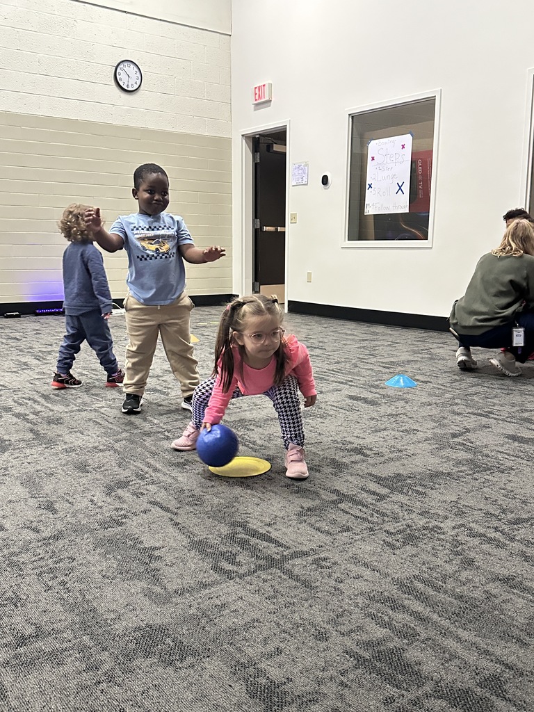elementary students learning bowling in PE class