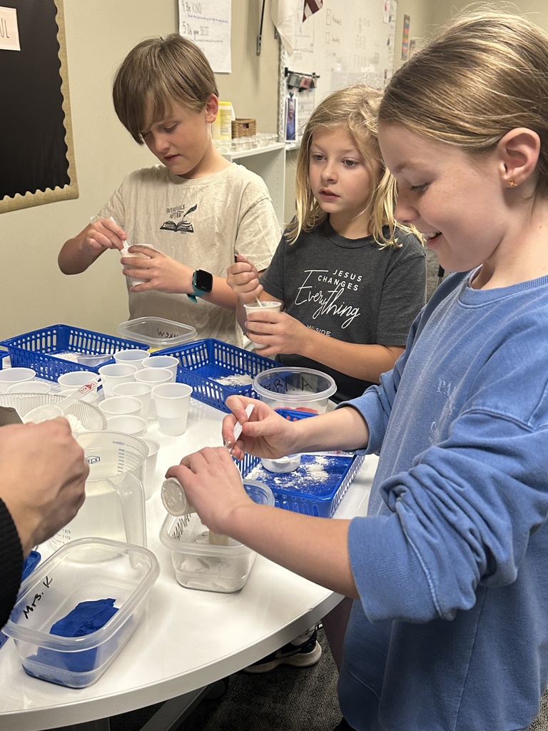 students making plaster for a fossil project