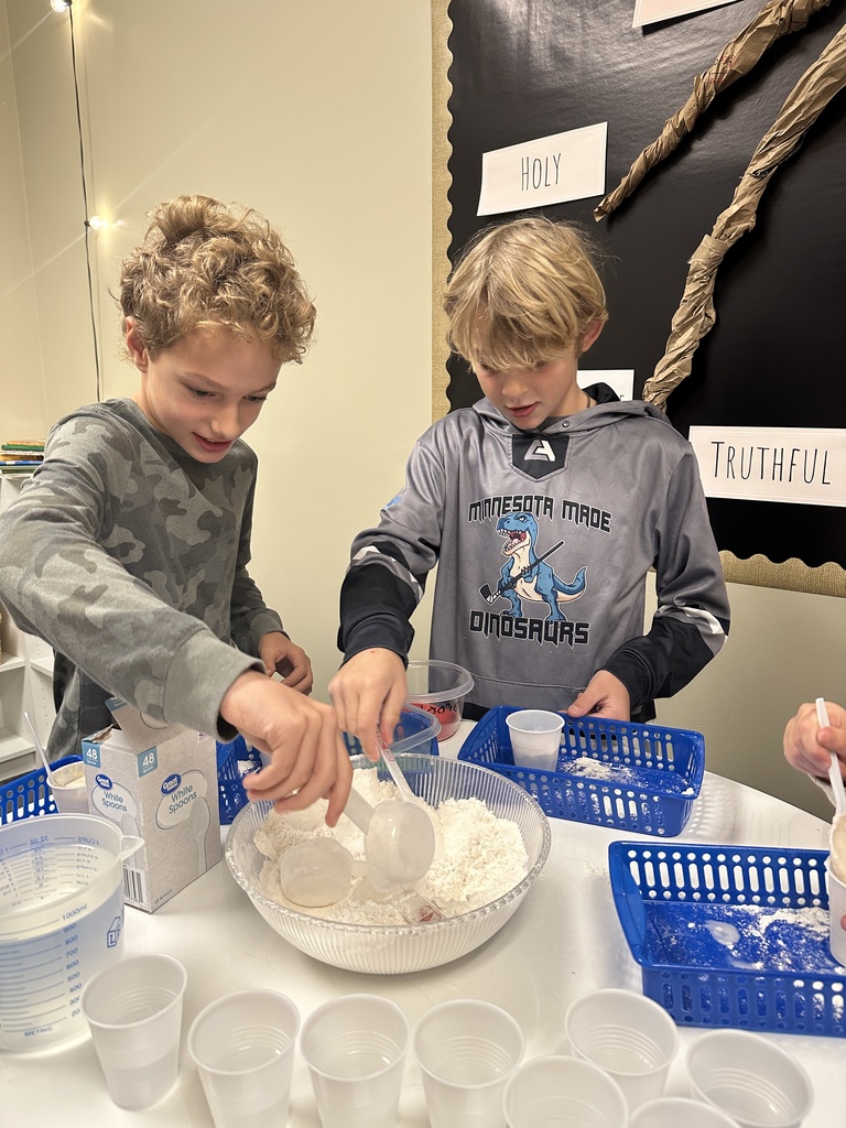 students making plaster for a fossil project