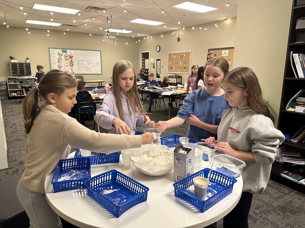 students making plaster for a fossil project