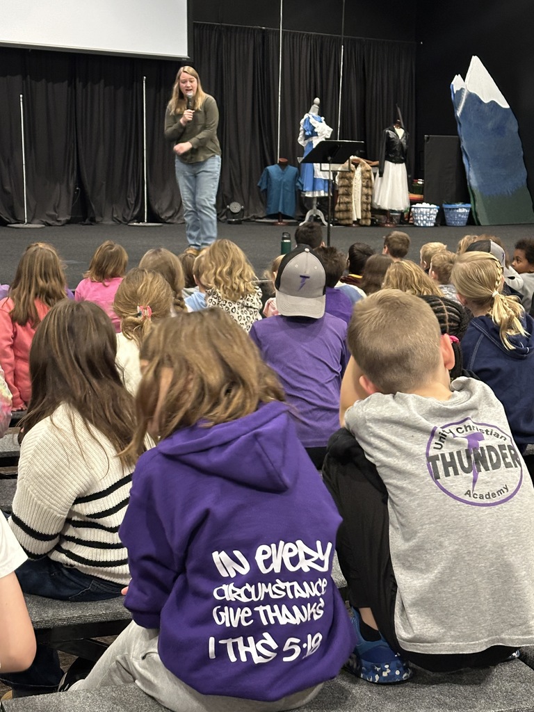 students in a chapel service listening to the speaker