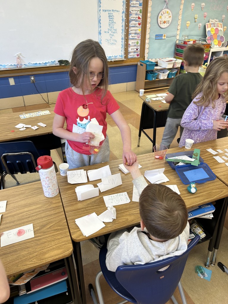 1st grade students practicing being producers and consumers