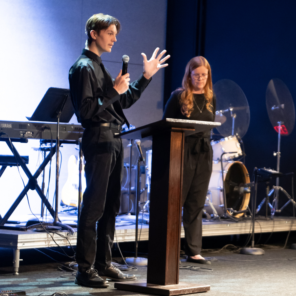 student giving a speech on stage