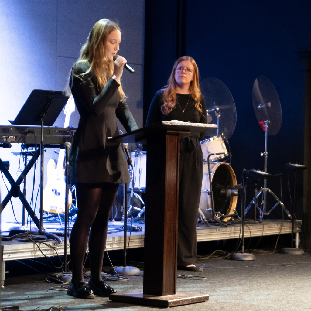 student giving a speech on stage