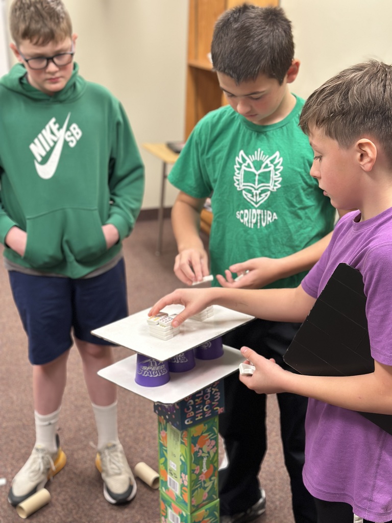 6th grade classmates building towers as a team building exercise