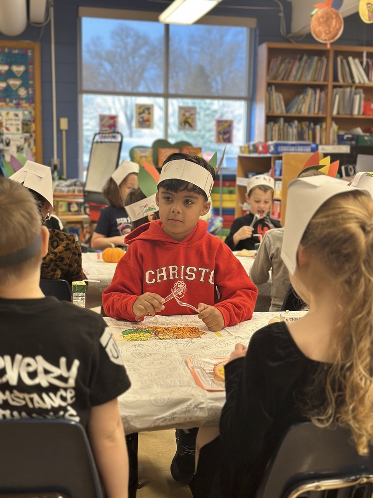 student holding his silverware waiting for his plate of food