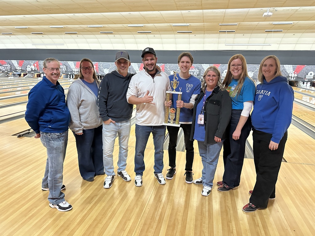 group photo of the winning team (Gratia) at the staff bowling night