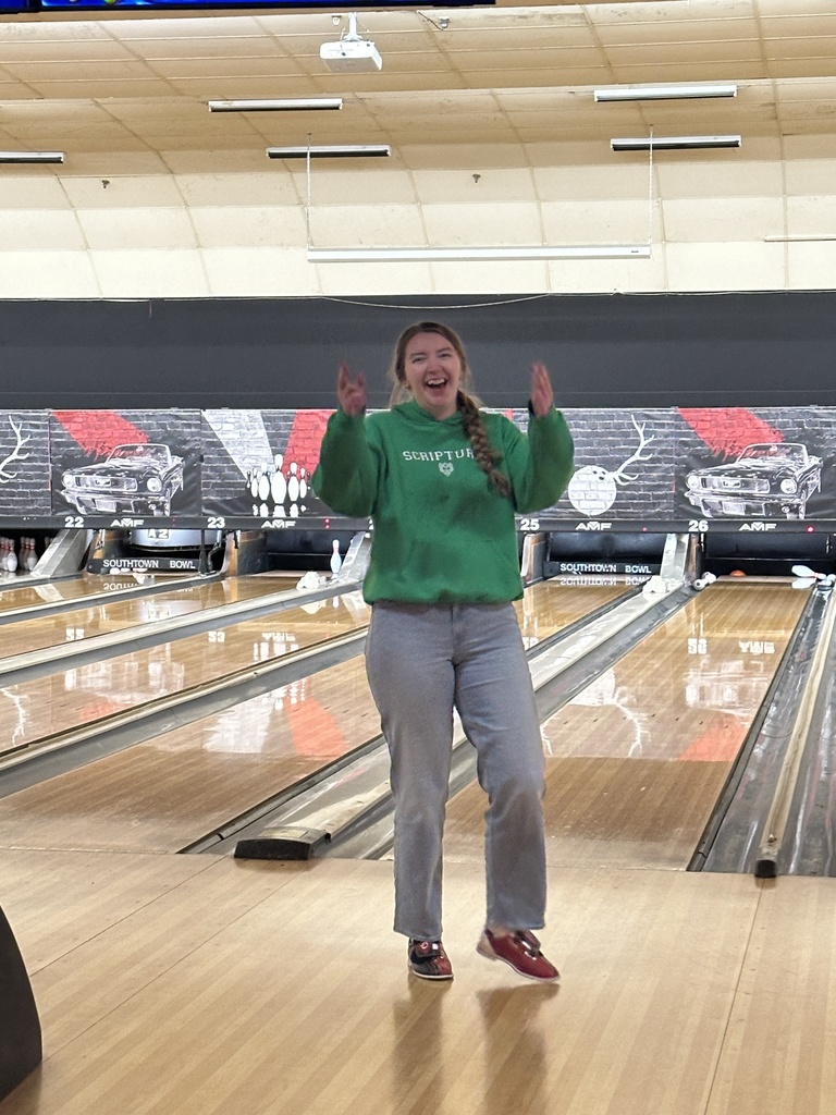 teacher celebrating after bowling a strike